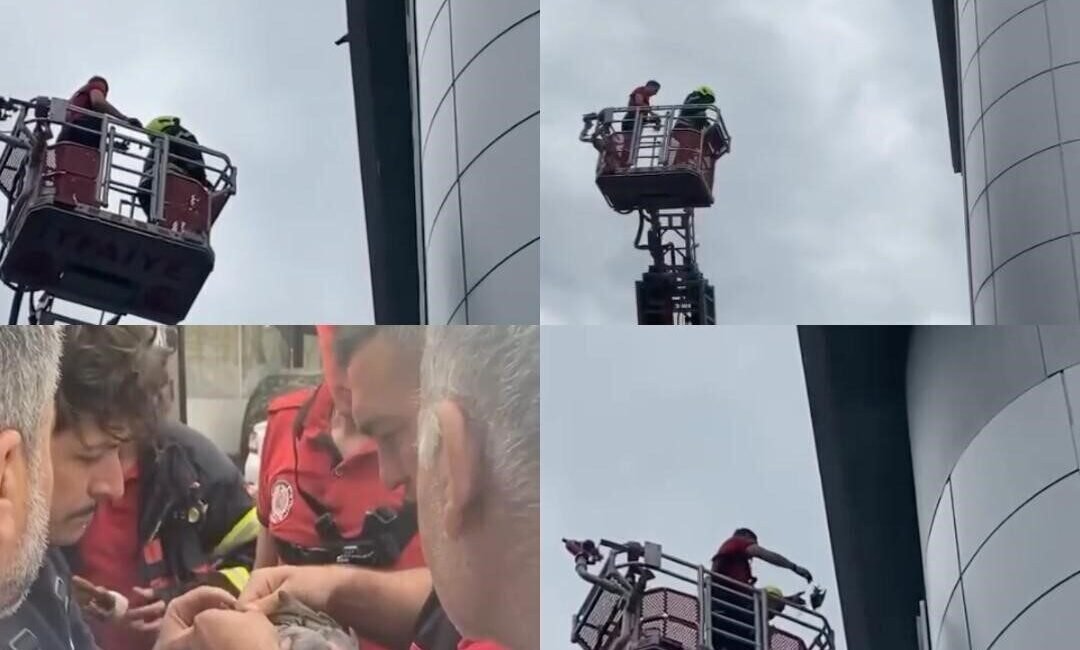 Mersin’de bir binanın çatısında ayağına ip dolandığı için mahsur kalan