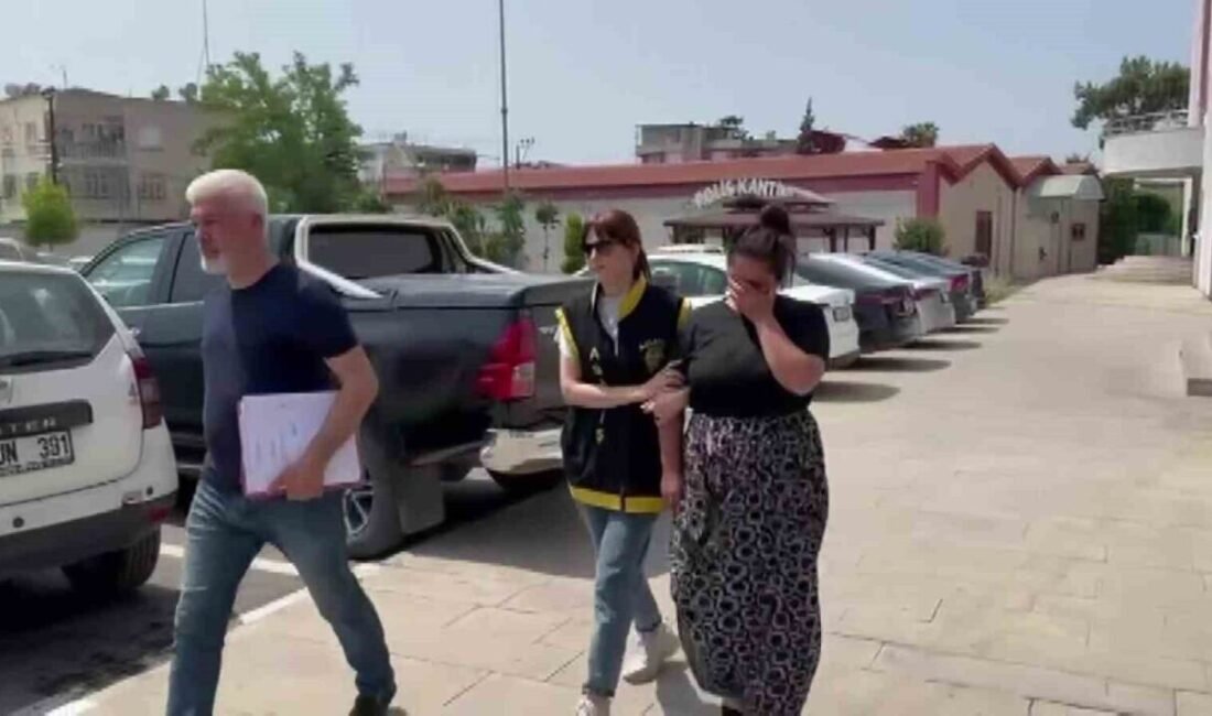 Adana’da tanınmamak için çarşaf giyen ve çocuğunu da kucağına alarak